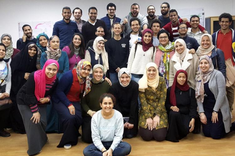 Group of students pose and smile