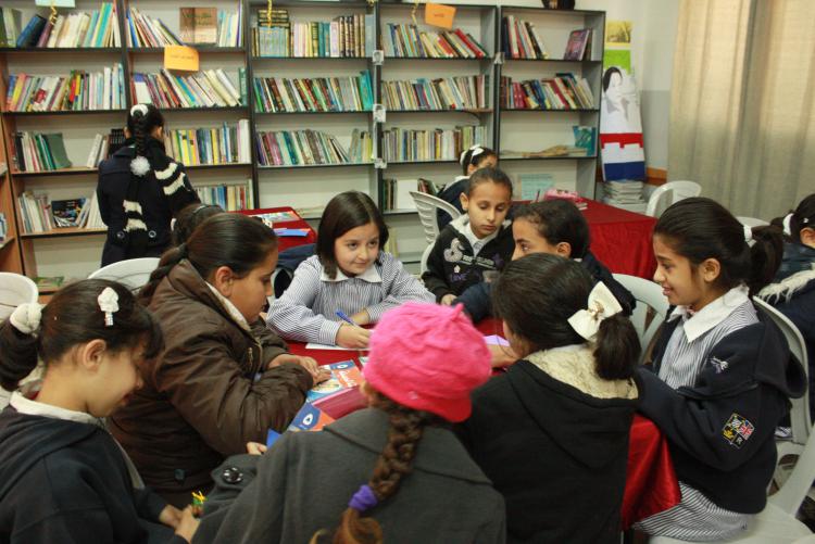 Kids sitting at a library