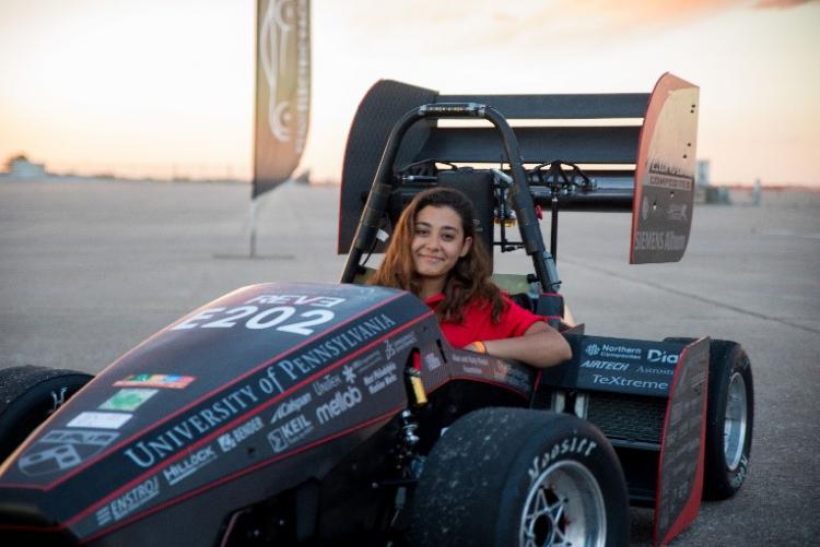 young woman in a racecar