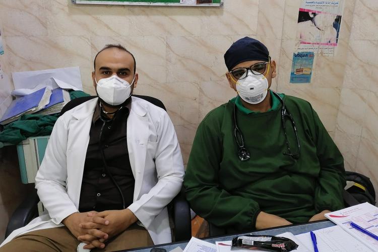 Two male nurses wearing masks