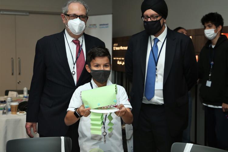 Ambassador Theodore H. Kattouf with Boeing META President Kuljit Ghata-Aura and a young learner. 