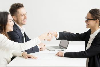 Recruiter shaking hands with candidate
