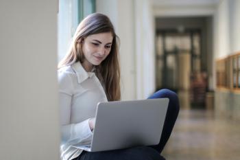 Young woman studies on a laptop