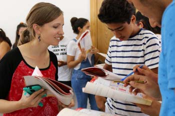 Teacher helps students with their classwork