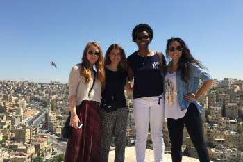 Students standing together overlooking the city of Amman