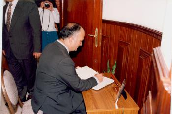 Man signing a document