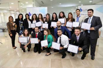 A group of professionals holding certificates