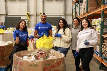 Group of Fulbright program students volunteering at food bank
