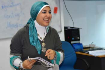 Teacher smiles while leading class