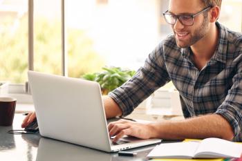 Man typing on laptop