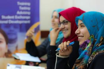 Smiling students in a classroom setting