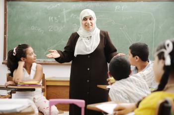 Teacher talking to students