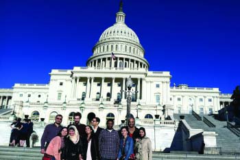 A group of Moroccans posing for a group photo outside the United States Capitol  in Washington D.C. 