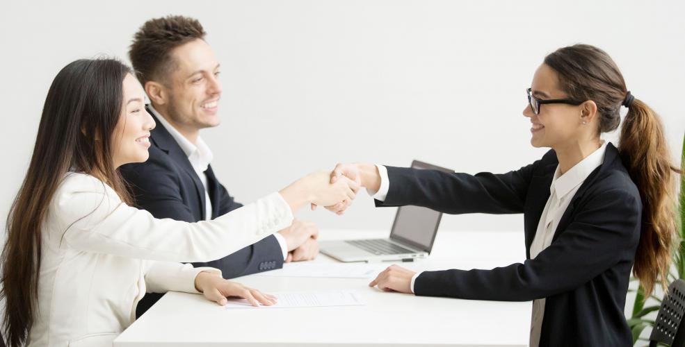 Recruiter shaking hands with candidate