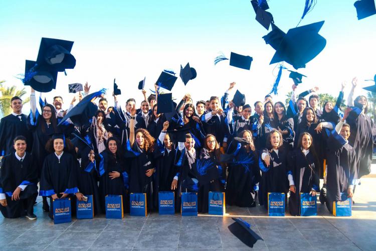 Graduates throwing caps in the air