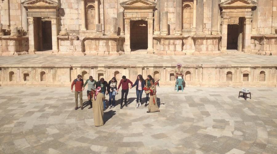 Students learn how do traditional Jordanian dances on the stage of the Roman theater in Jerash, Jordan.