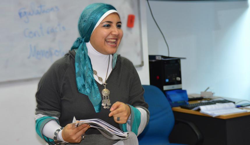 Teacher smiles while leading class