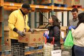 Two individuals talking while volunteering