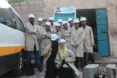 Group photo of Nahdhat Shabab Project students in the automobile repair track