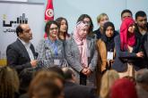 A group of BLADI participants stand on stage