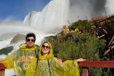 Two students in front of a waterfall