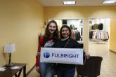 Two students holding Fulbright sign