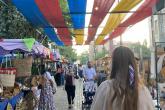 A student walks away from the camera into the souq in Jordan