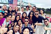 Group of students outside in front of a bridge