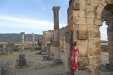 A student poses with the Ruins at the Roman city of Volubilis