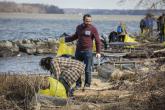 Students clean up trash at a beach