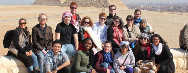 AMIDEAST/Egypt abroad students pose in front of the Great Pyramid of Giza.