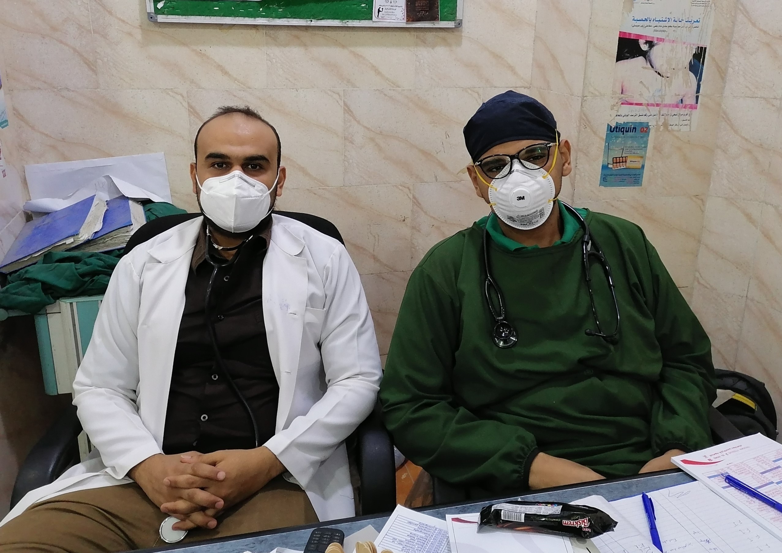 YES alumnus Omer (right) and a colleague during ER duty at his hospital in Aden. Two male nurses wearing masks