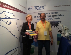 Title AMIDEAST Country Director for the UAE Mary Corrado presents a booth drawing prize to Khaled Mohammad Ali of the Ministry of Education, a first-time winner after 15 years attending the conference.