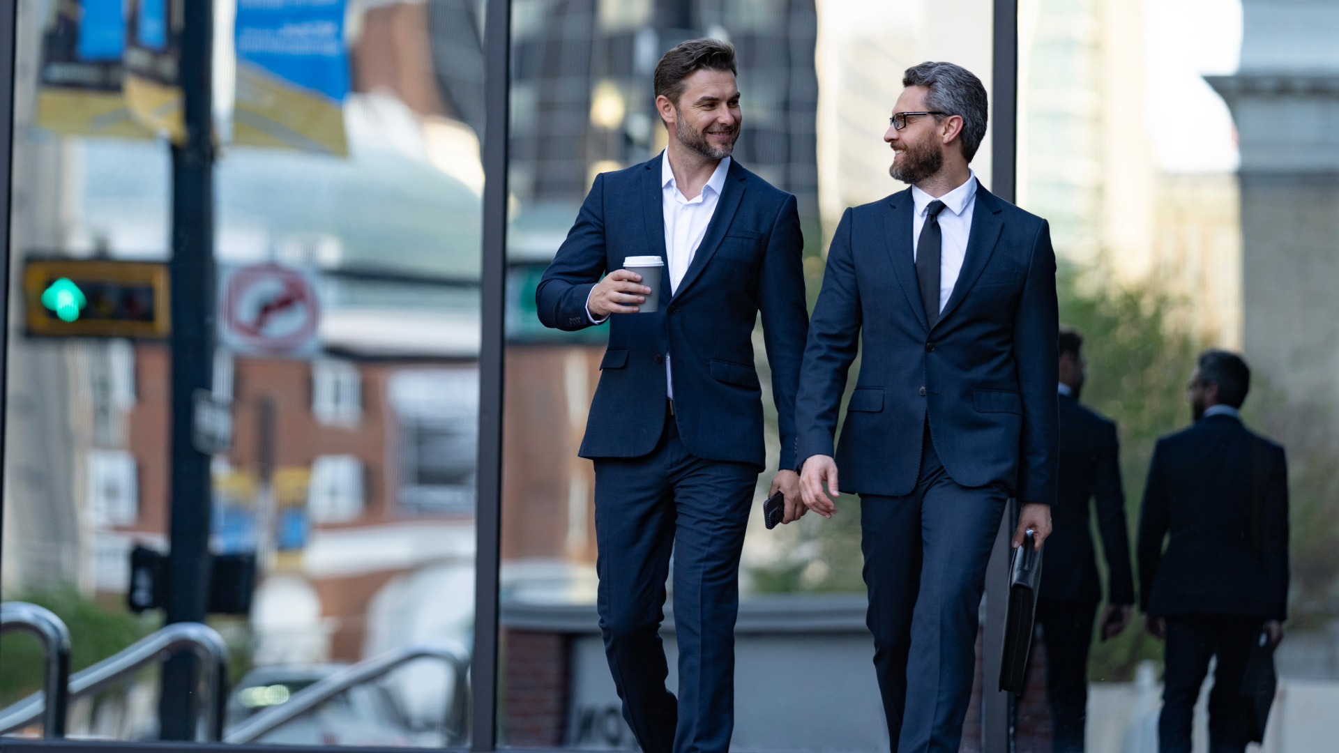  Two businessmen in elegant business suit speaking in English - TOEIC test 