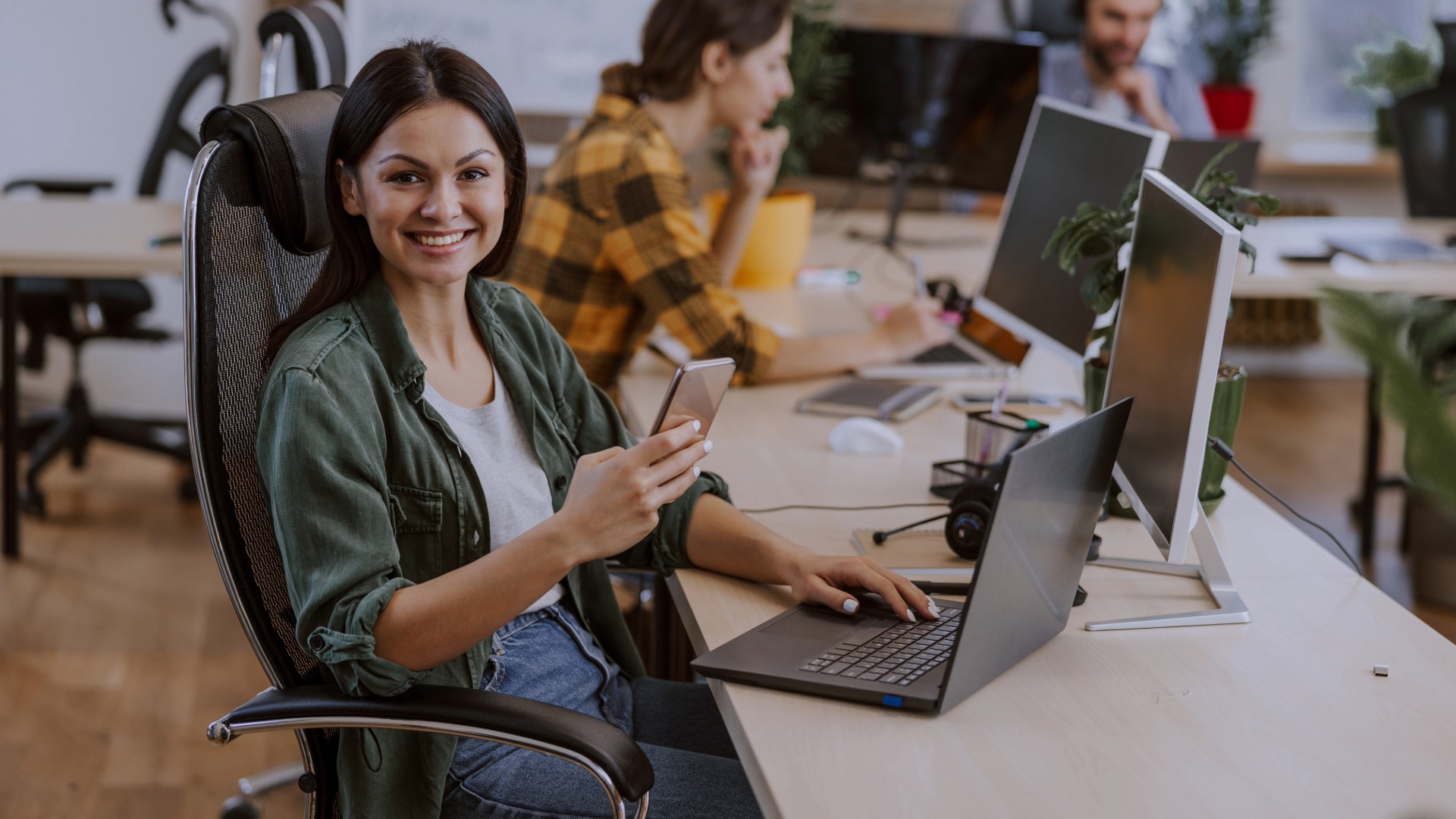 A Smiling Female employee working a modern office