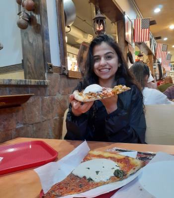 Student with pizza 