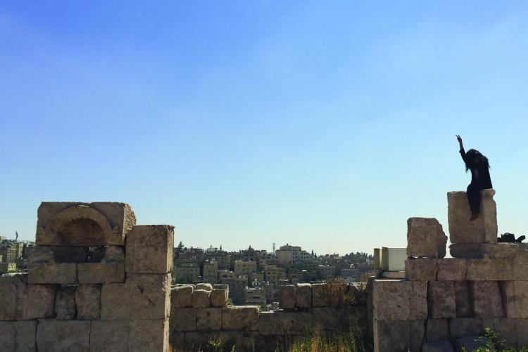 A student exploring the Roman ruins of Amman