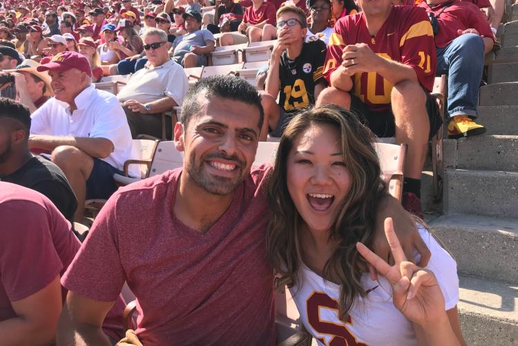 Male and Female student at a football game