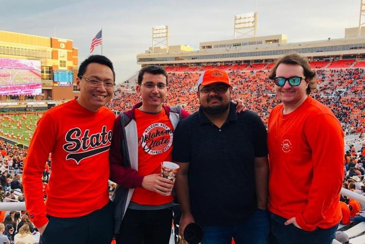 Four students at a football game