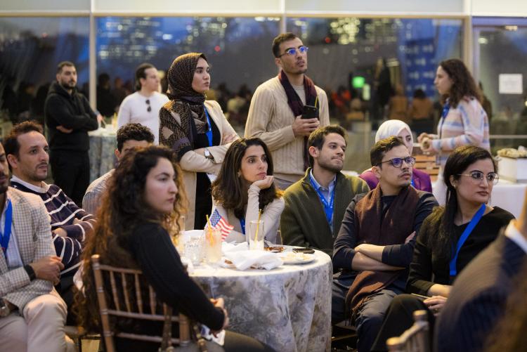 Group of students at a table. 