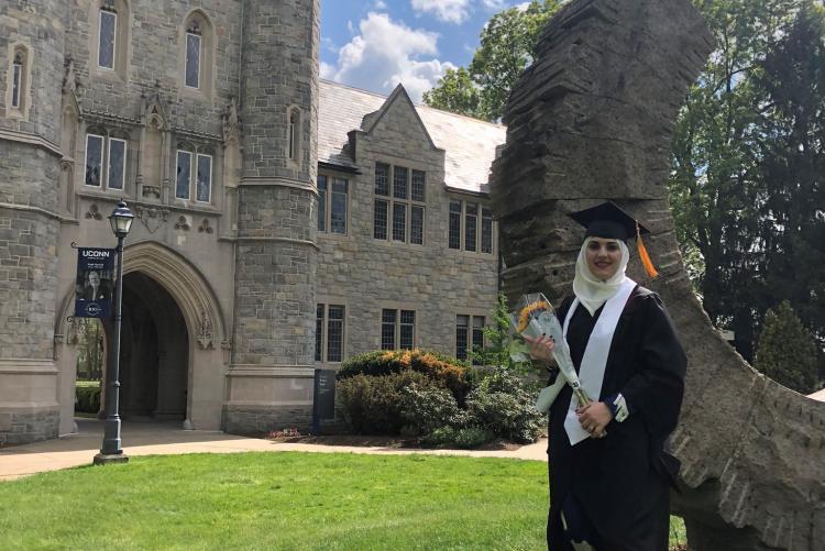 Student at graduation in cap and gown