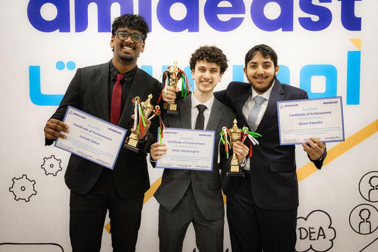 Students taking a picture with their certificates