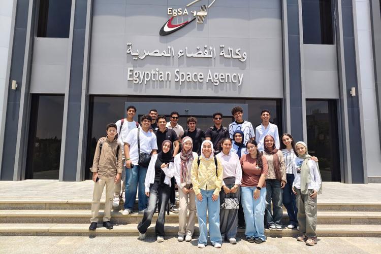 Students taking a photo outside of the Egypt Space Agency
