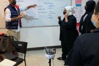 Kuwaiti English teachers in a PCELT session assisted by a SWIVL robot