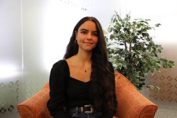 Nataly sitting in a chair 
