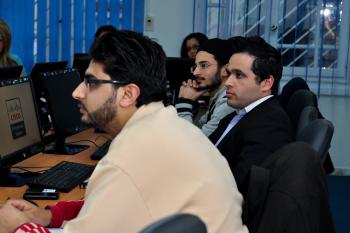 company staff look attentively towards their teacher who is offscreen 
