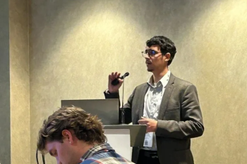Man speaking with microphone.