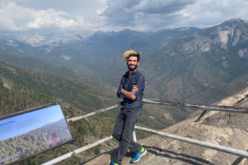 Man posing on a mountain.