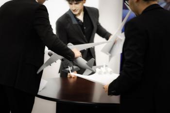 Students working with airplaine models